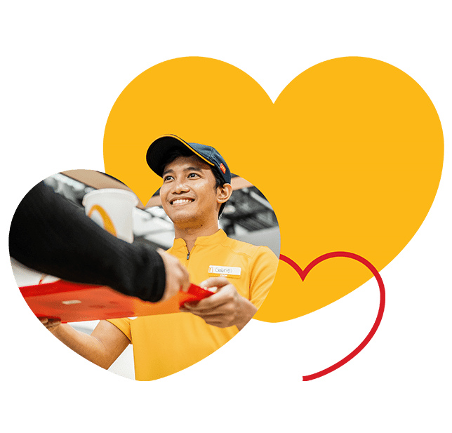 male serving mcdonalds happy meal to customer